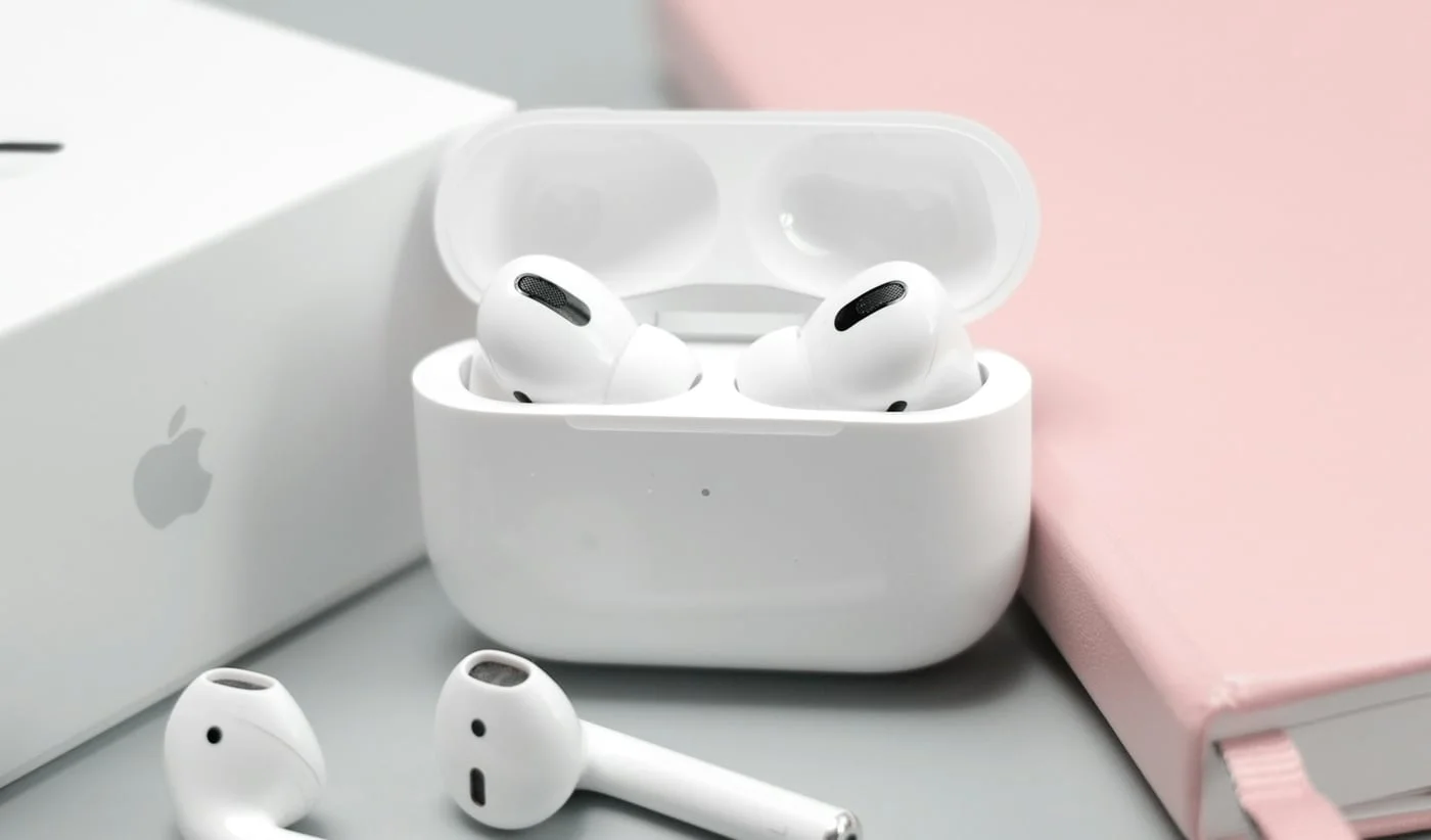 White wireless earbuds with charging case